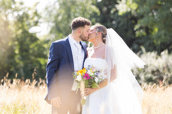 Bride and Groom kiss